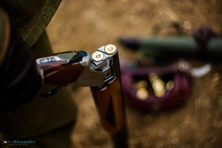 open over and under shotgun with cartridges with loader bag