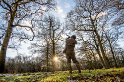 gun shooting through the trees on a pheasant shoot in England