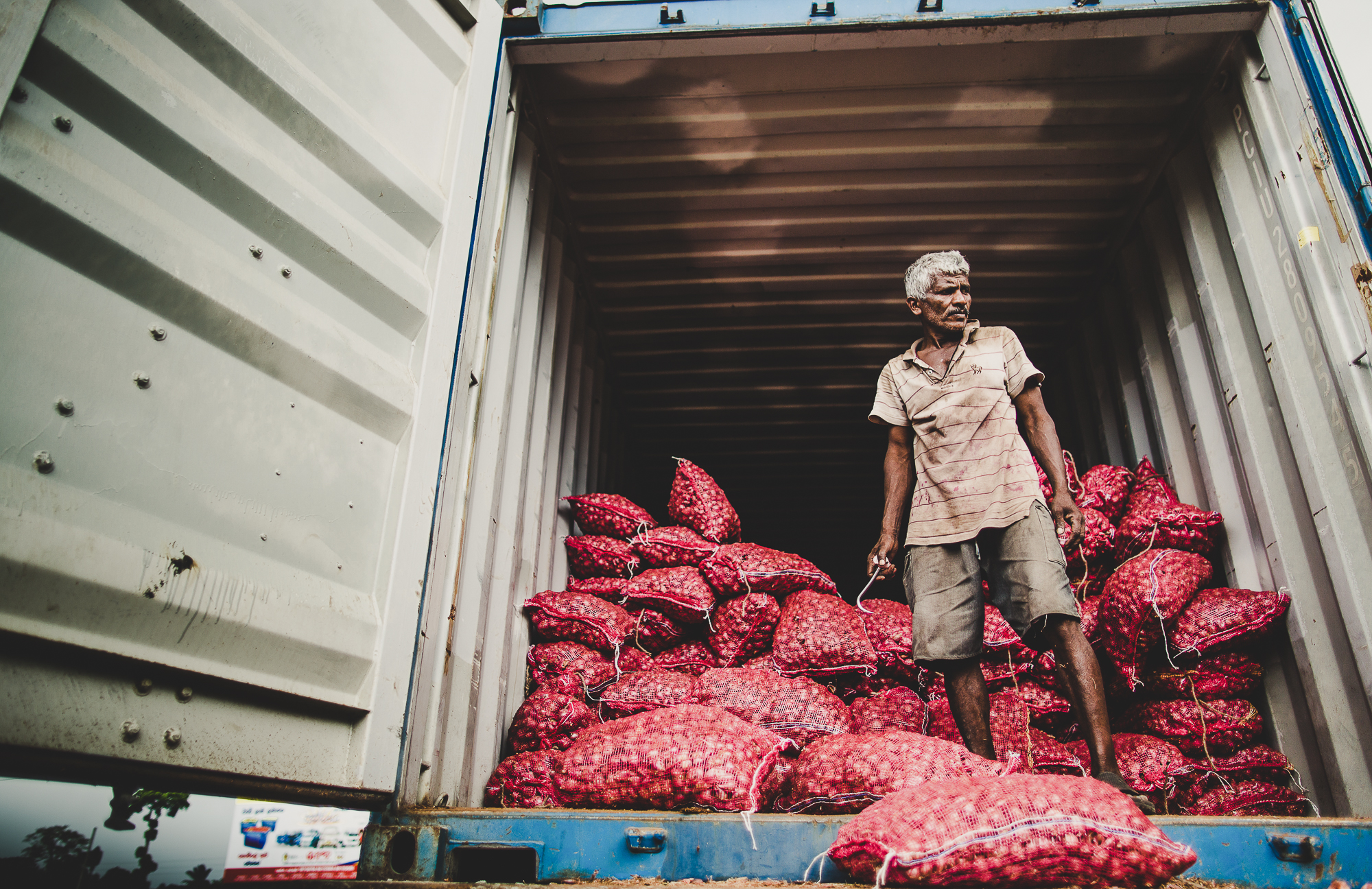 Unloading shallots from a truck